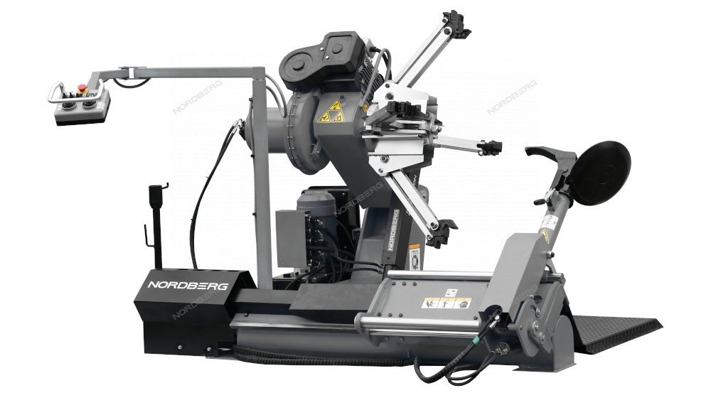 7u3p7lhg6dv7lta1r0lw1atae14613s0 Станок шиномонтажный для грузовых автомобилей 14"-42", с пультом на штанге, 380V, серый NORDBERG 46TRK42(G) — изображение 1